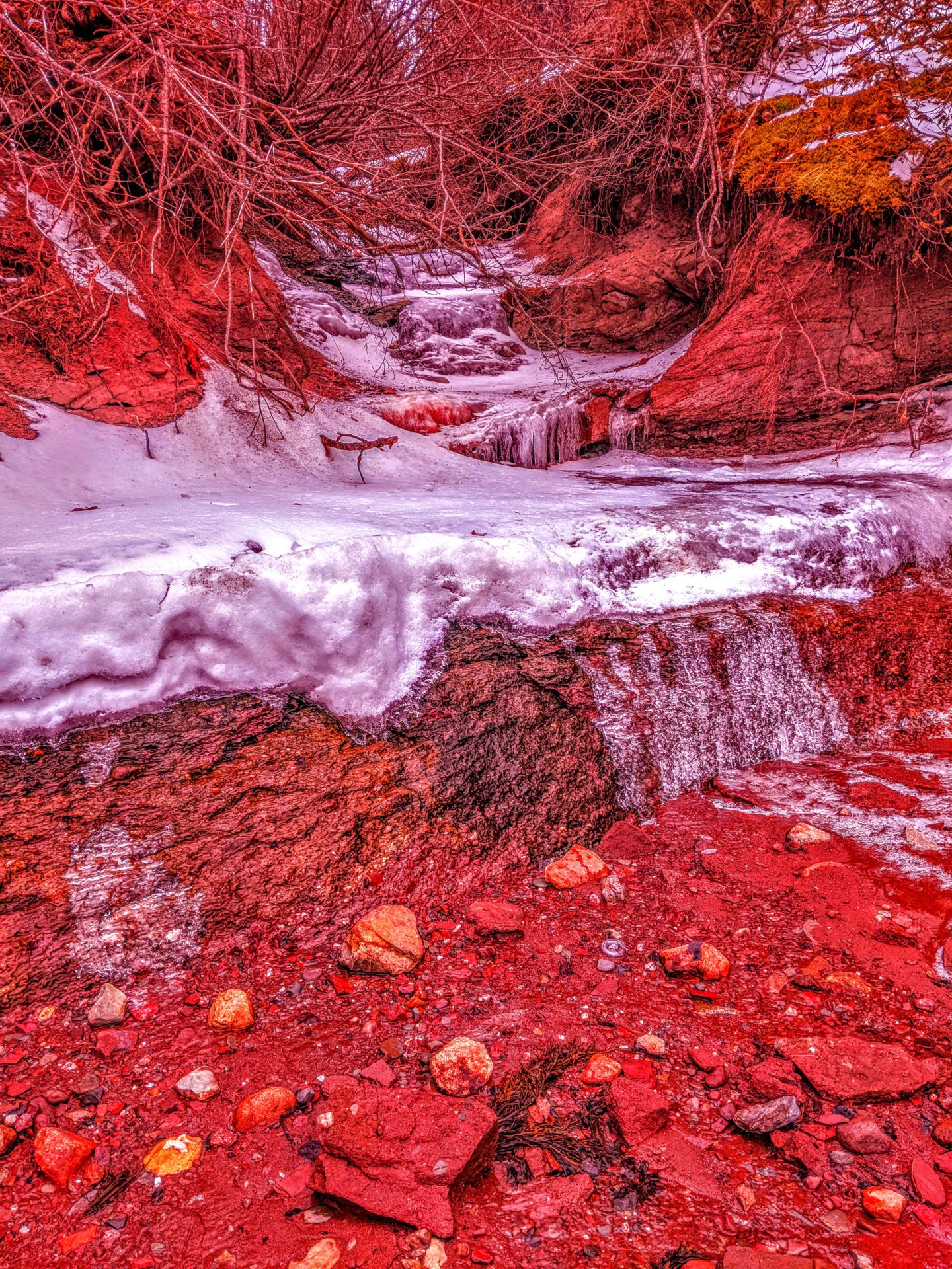 red rock with a ice fall